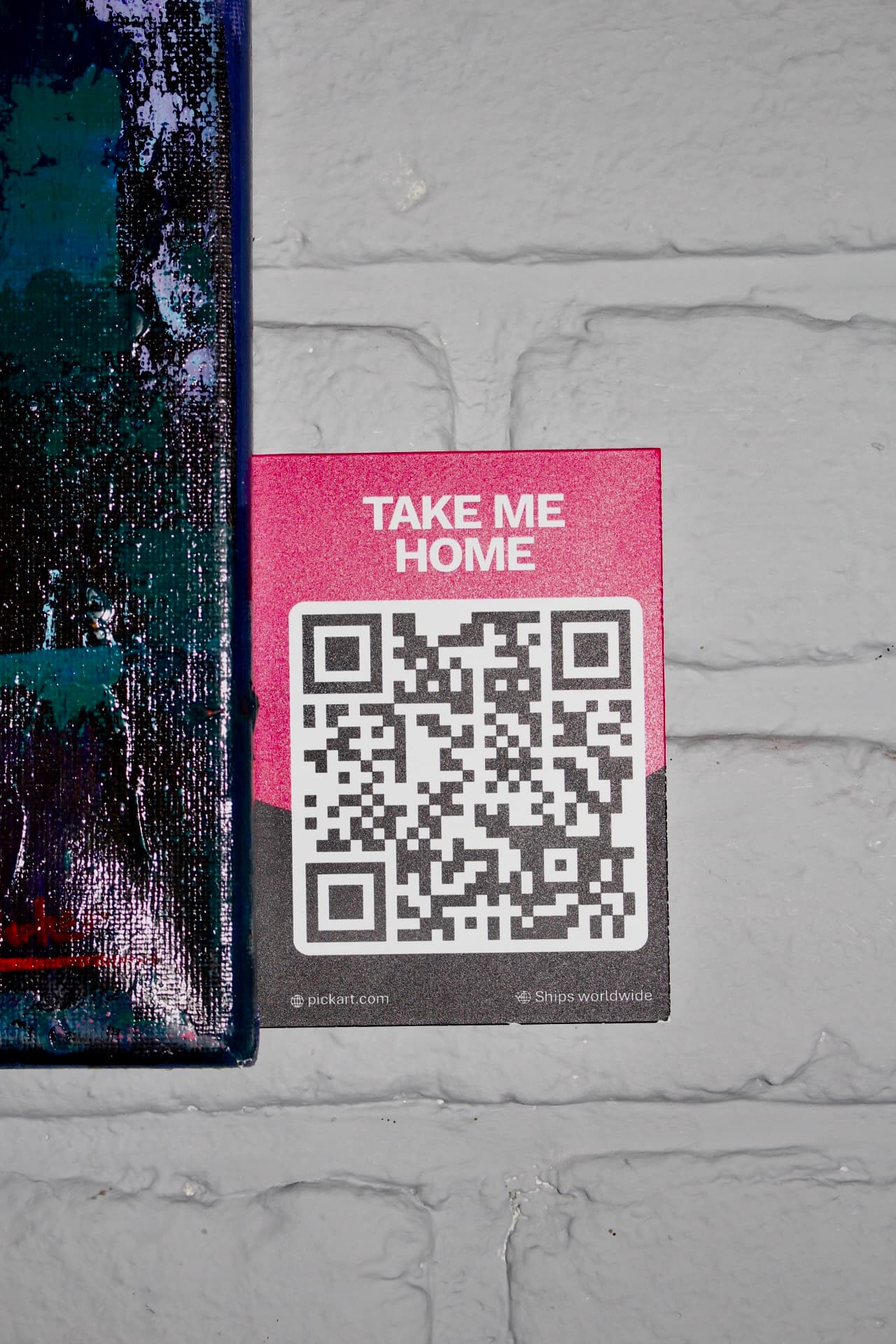 Contemporary artwork displayed with an exhibition label in a PickArt partner space with an example PickArt QR label allowing artwork detail discoverability without putting it all on the wall