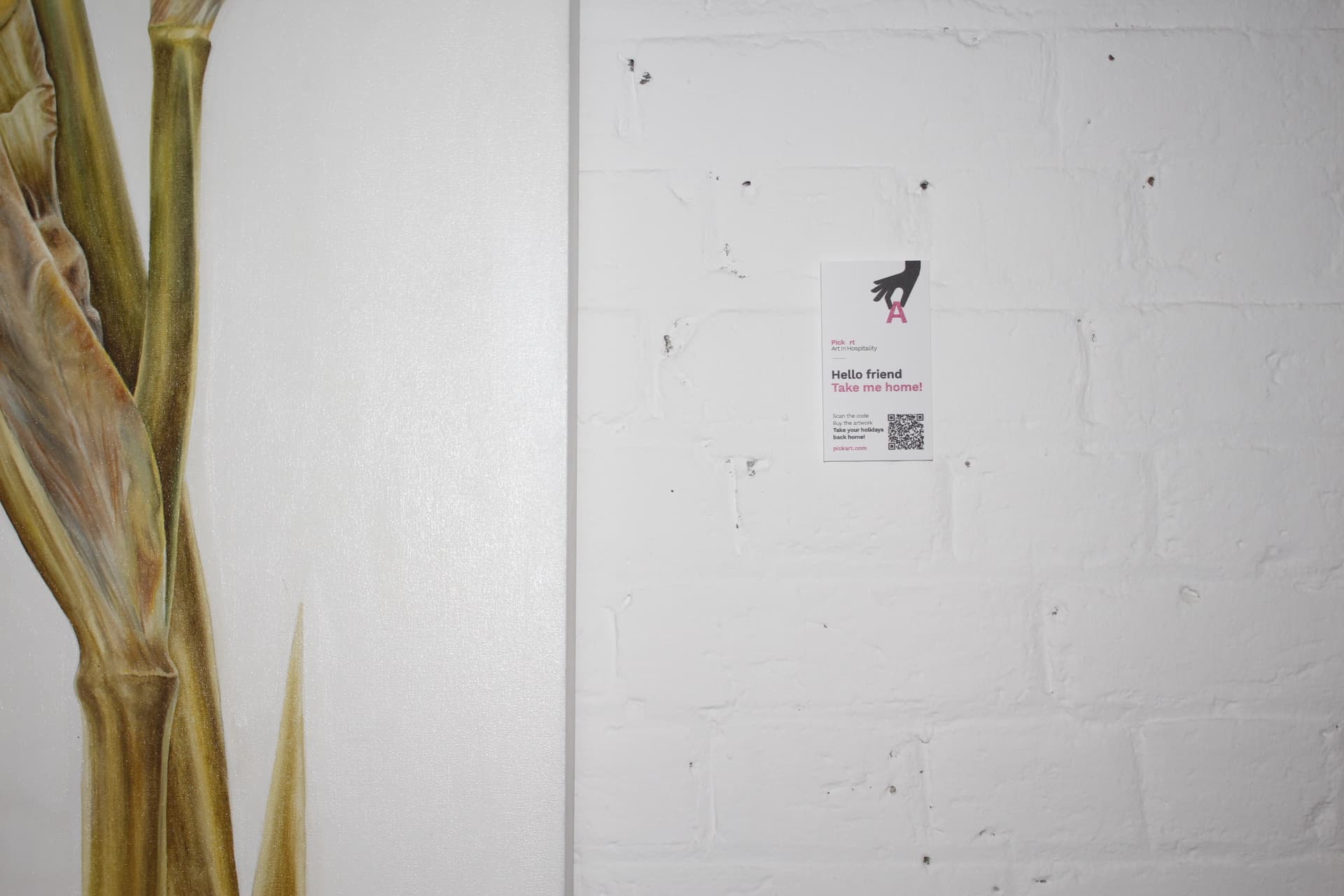 A guest scanning a QR code next to an artwork to learn more