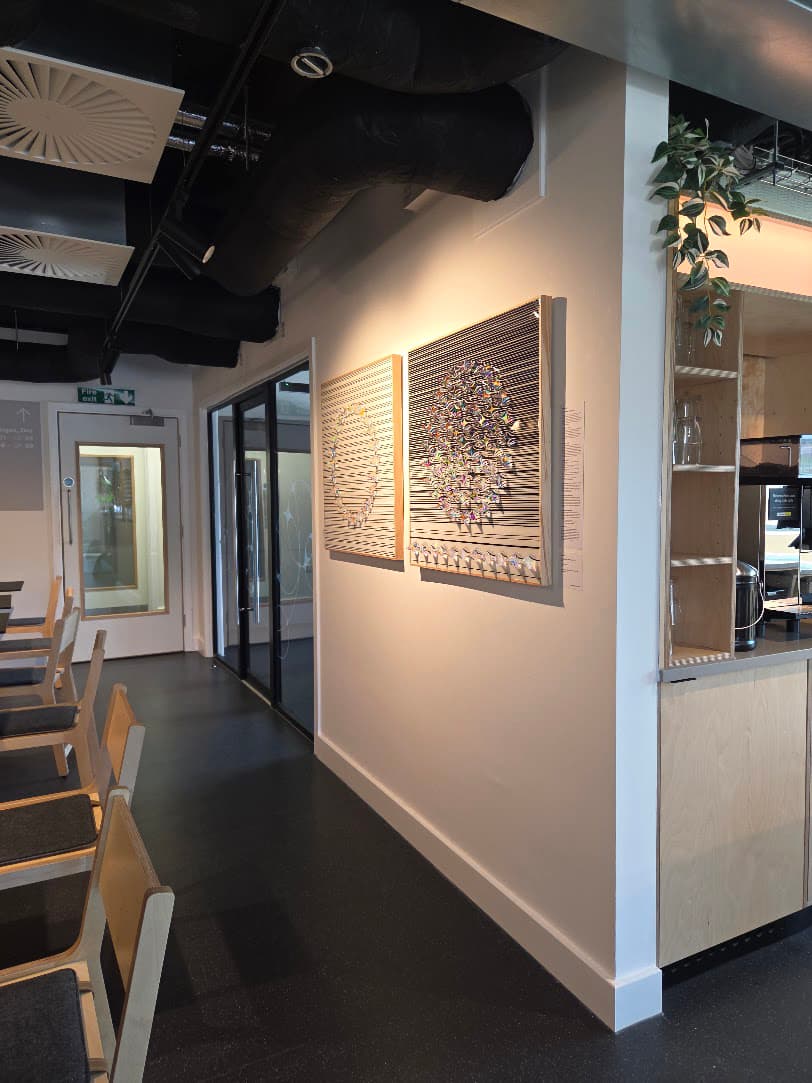 Original artwork displayed on the wall of a hospitality venue