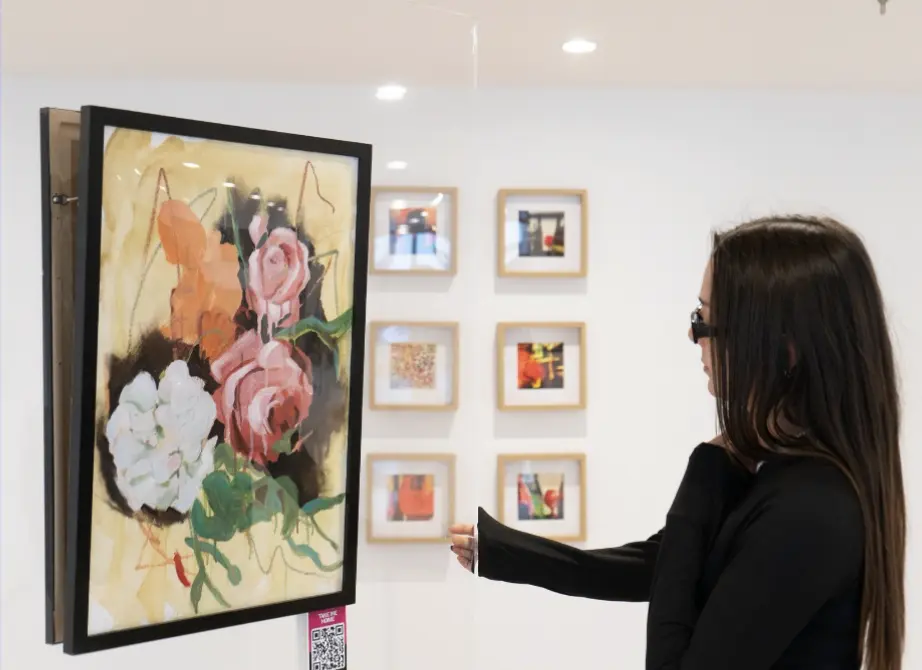 Curatorial Director Olivia Abando presenting a Rae George artwork at Supercity, York, alongside a PickArt QR code