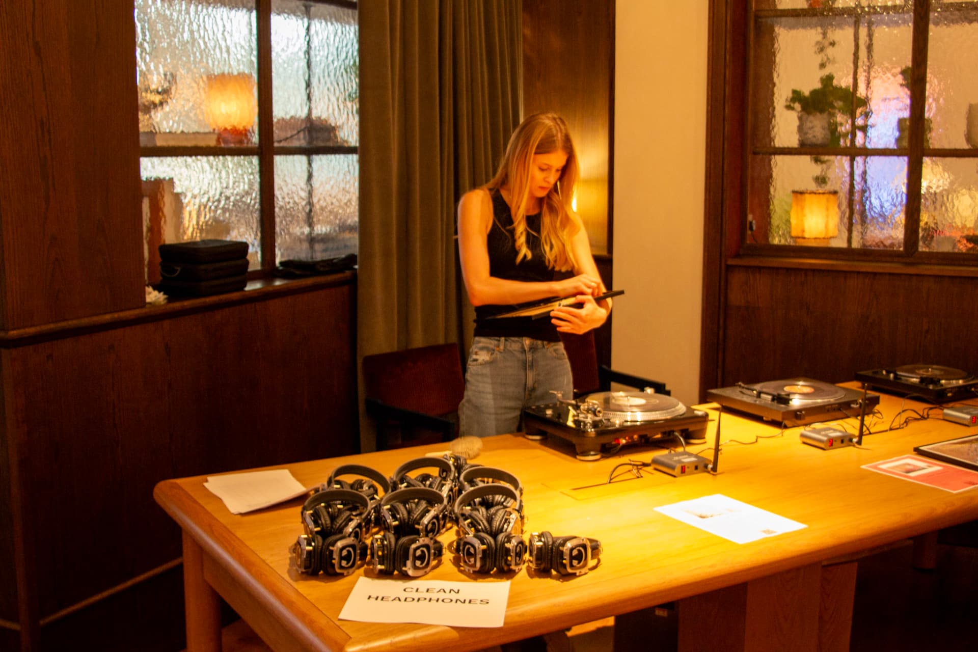 Turntables, radio transmitters and headphones set up for the evening